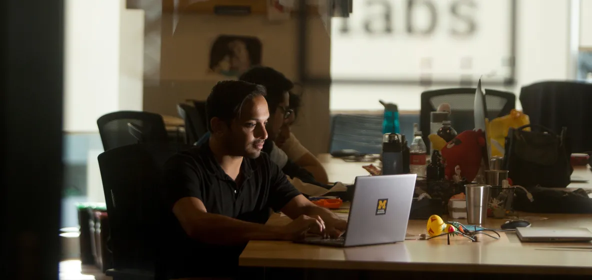 multiple students working in a dark room